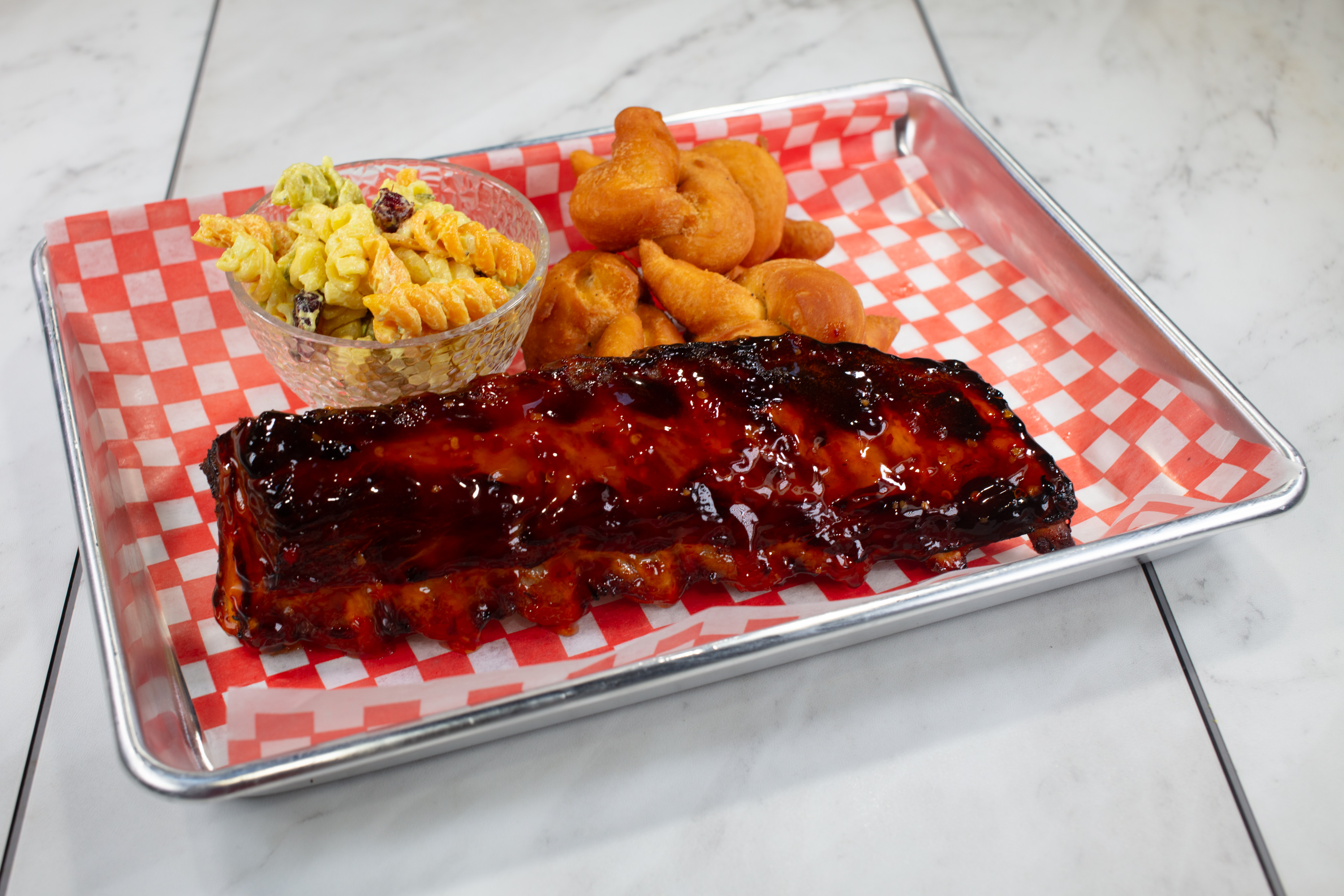 BBQ ribs meal with rice and sides