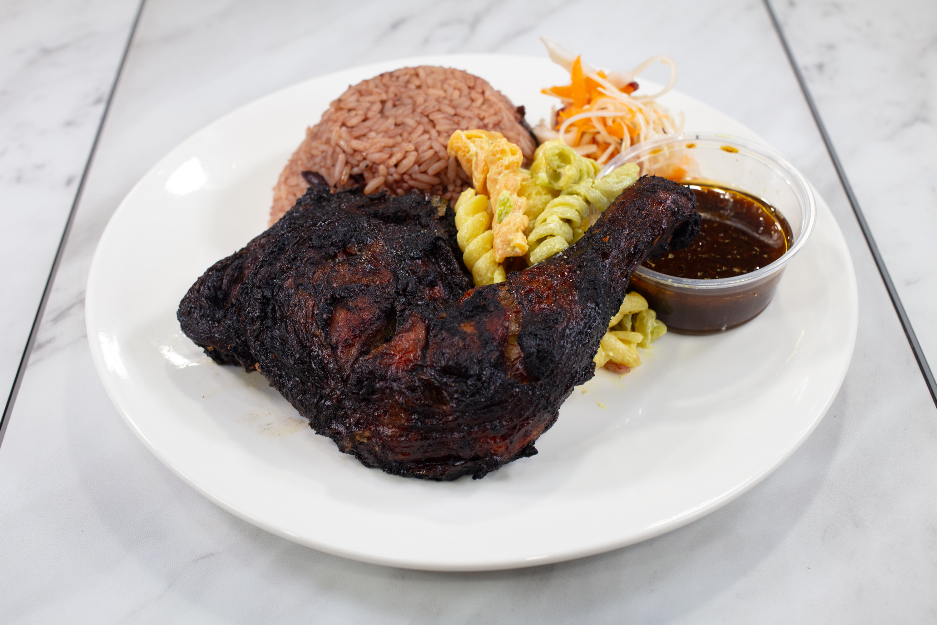 Jerk chicken meal with rice and sides